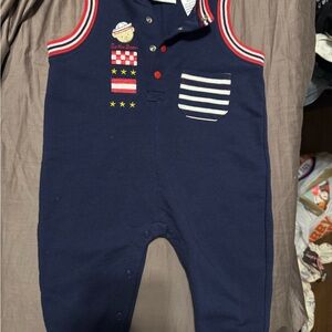 First Impressions Navy Romper with Red and White Accents